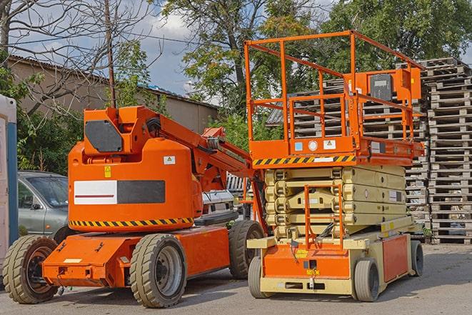 forklift moving crates in a large warehouse in Chino